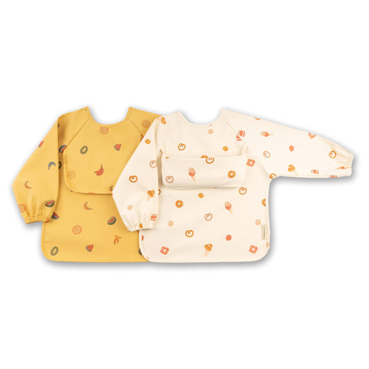 ÜneeQbaby Waterproof Baby and Toddler Bibs - Pack of 2, Long Sleeve Oeko-TEX for Feeding and Messy Play with Chest Pocket, Coverall Mock Small (6-18 Months) Yellow Fruits, off white Sweets